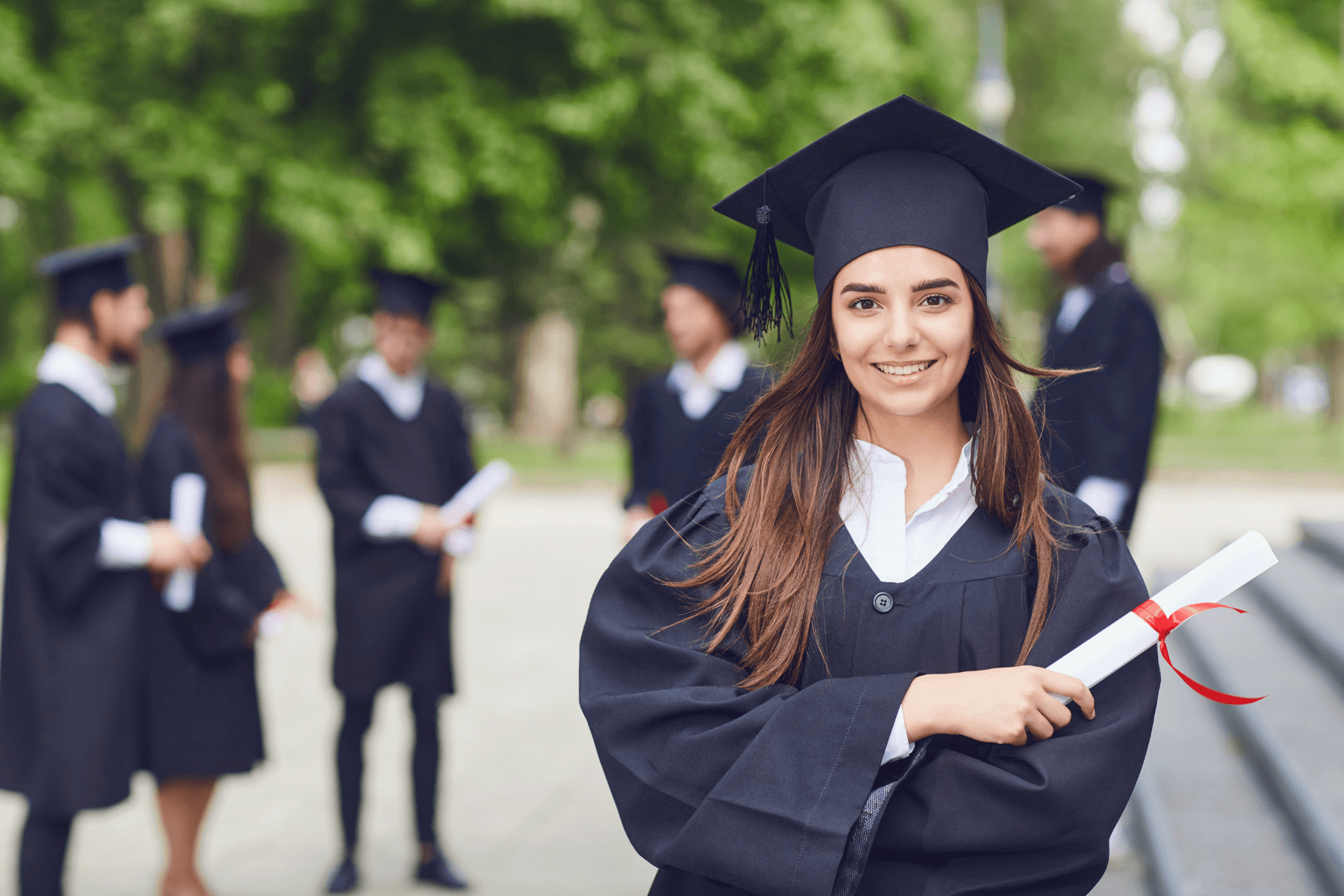 Smiling young woman graduates from degree